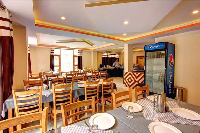 Imagen del bar/restaurante del Hotel Snow Country Manali. Foto 3
