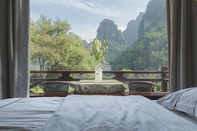 Imagen de la habitación del Hotel Snow Lion Riverside Resort. Foto 13