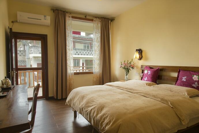 Imagen de la habitación del Hotel Snow Lion Riverside Resort. Foto 15