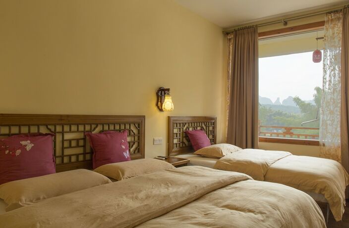 Imagen de la habitación del Hotel Snow Lion Riverside Resort. Foto 19