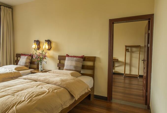 Imagen de la habitación del Hotel Snow Lion Riverside Resort. Foto 21