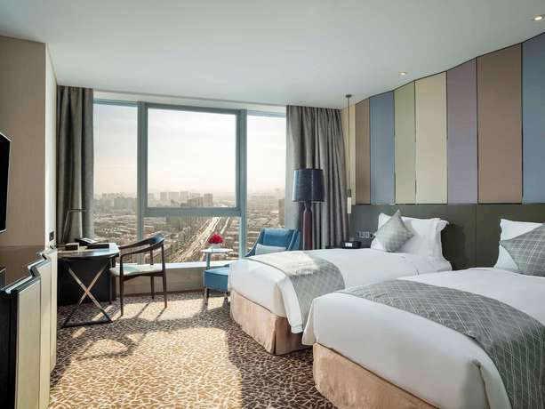 Imagen de la habitación del Hotel Sofitel Lianyungang Suning. Foto 13