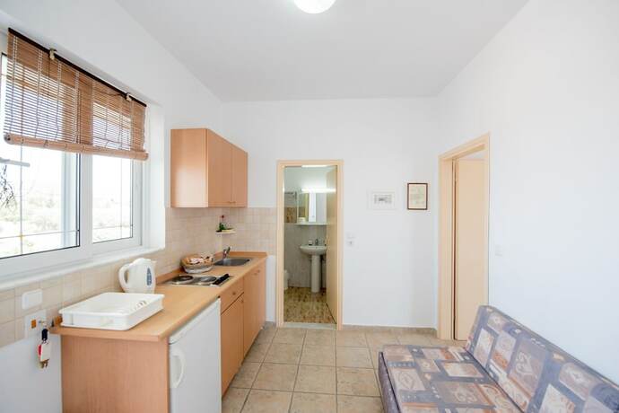 Imagen de la habitación del Hotel Sokrates Studios. Foto 18