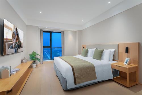 Imagen de la habitación del Hotel Somerset Fengdong Xi\'an. Foto 17