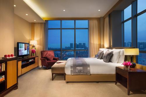 Imagen de la habitación del Hotel Somerset Grand Central Dalian. Foto 6