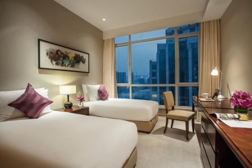 Imagen de la habitación del Hotel Somerset Grand Central Dalian. Foto 7