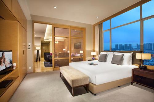Imagen de la habitación del Hotel Somerset Grand Central Dalian. Foto 9