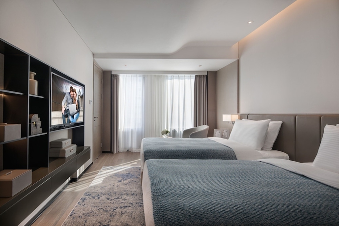 Imagen de la habitación del Hotel Somerset Ioc Hangzhou. Foto 4