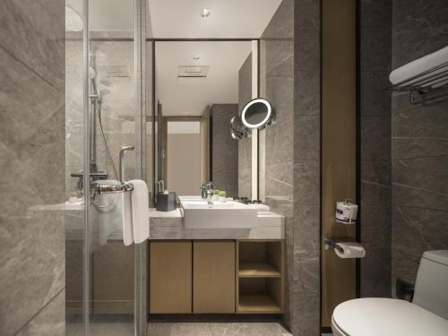 Imagen de la habitación del Hotel Somerset Pudong Riverside Shanghai. Foto 19