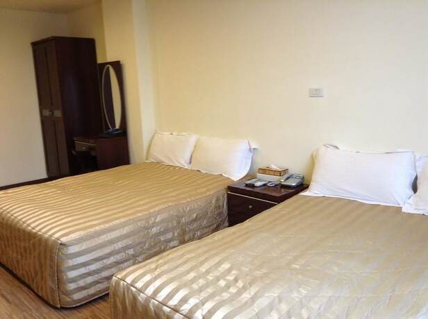 Imagen de la habitación del Hotel Song He Homestay. Foto 26