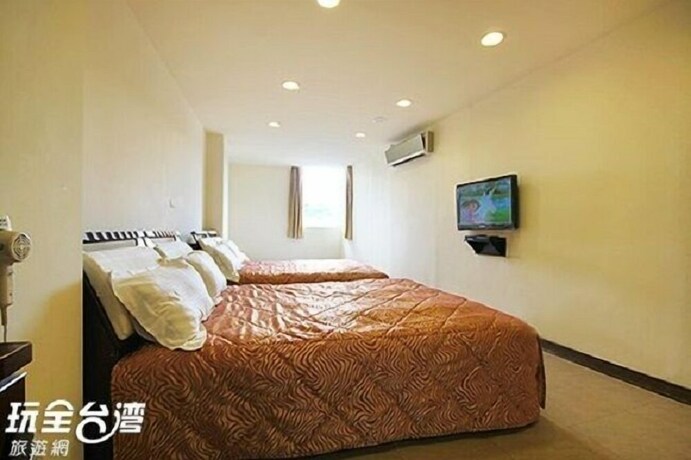 Imagen de la habitación del Hotel Song He Homestay. Foto 27