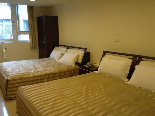 Imagen de la habitación del Hotel Song He Homestay. Foto 31