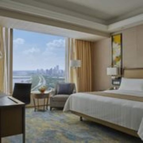 Imagen de la habitación del Hotel Songbei Shangri-La Harbin. Foto 2