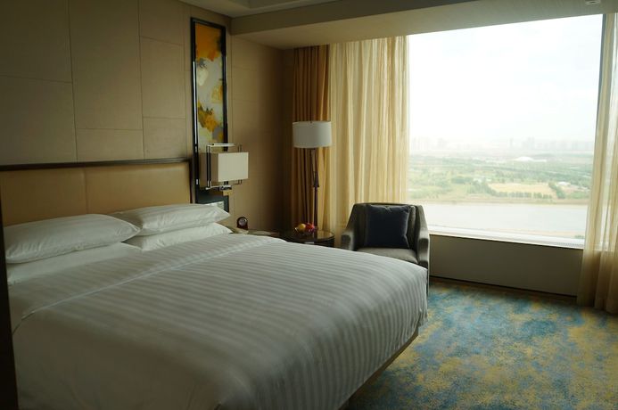 Imagen de la habitación del Hotel Songbei Shangri-La Harbin. Foto 3