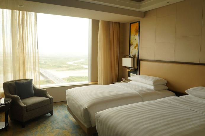 Imagen de la habitación del Hotel Songbei Shangri-La Harbin. Foto 4