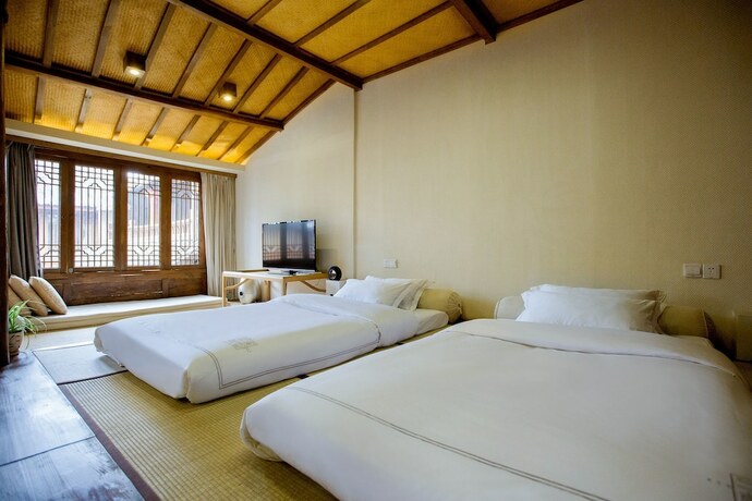 Imagen de la habitación del Hotel Songshi Guqin Inn. Foto 17