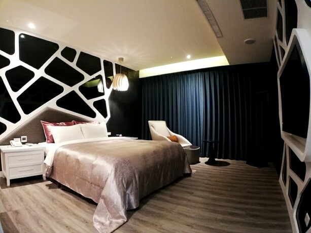 Imagen de la habitación del Hotel Songxiamotel. Foto 17