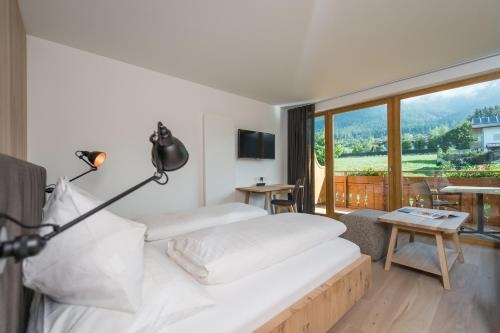 Imagen de la habitación del Hotel Sonnenhof Sun/spa/panorama. Foto 10