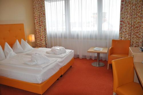 Imagen de la habitación del Hotel Sonnenpark & Therme (included). Foto 6