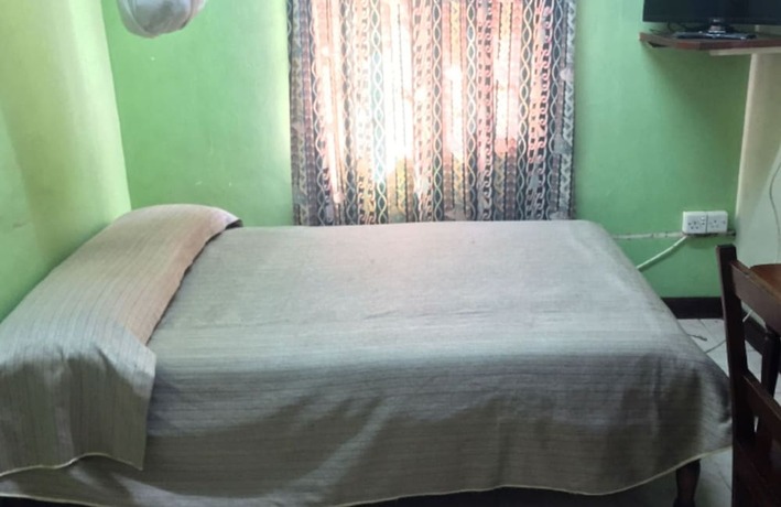 Imagen de la habitación del Hotel Sooper Guest House. Foto 4