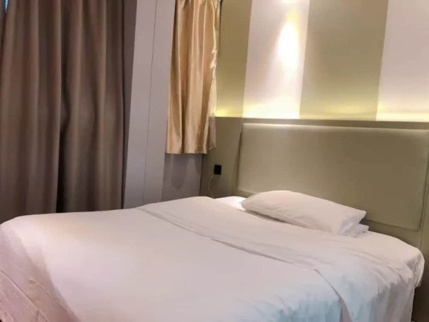 Imagen de la habitación del Hotel Sophie Roland Shenzhen Huaxin. Foto 11