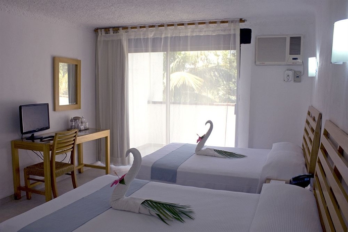 Imagen de la habitación del Hotel Sotavento and Yacht Club. Foto 10