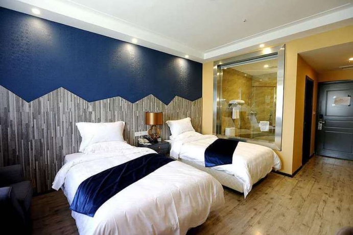 Imagen de la habitación del Hotel Sotel Cultura Huangguoshu Branch. Foto 11