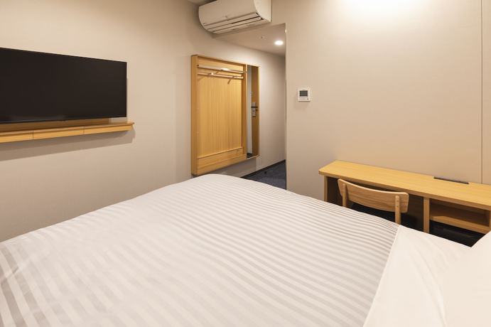 Imagen de la habitación del Hotel Sotetsu Fresa Inn Daimon. Foto 2