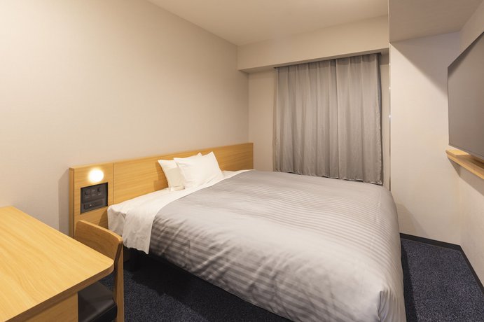 Imagen de la habitación del Hotel Sotetsu Fresa Inn Daimon. Foto 5