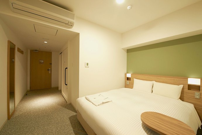Imagen de la habitación del Hotel Sotetsu Fresa Inn Daimon. Foto 6