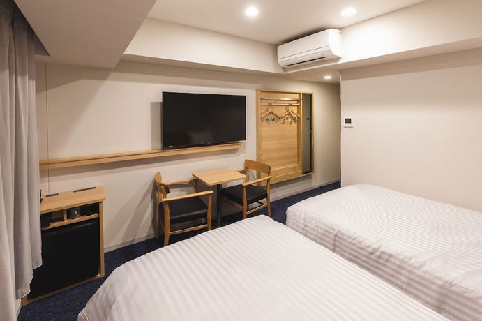 Imagen de la habitación del Hotel Sotetsu Fresa Inn Daimon. Foto 8