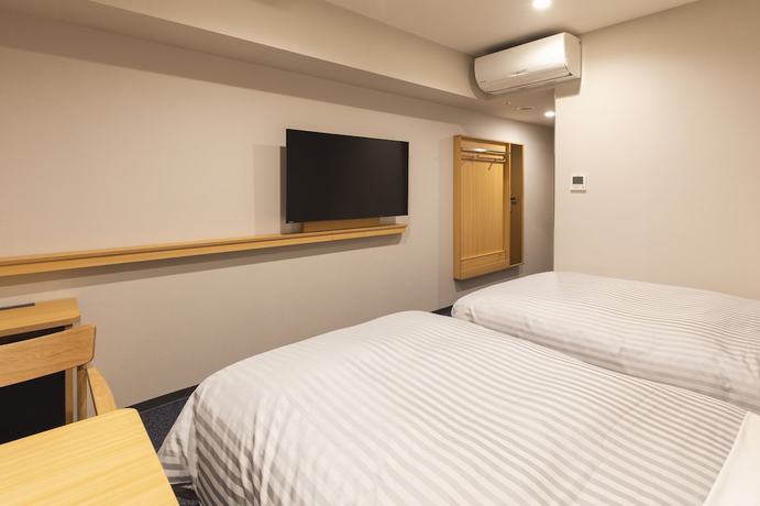 Imagen de la habitación del Hotel Sotetsu Fresa Inn Daimon. Foto 19