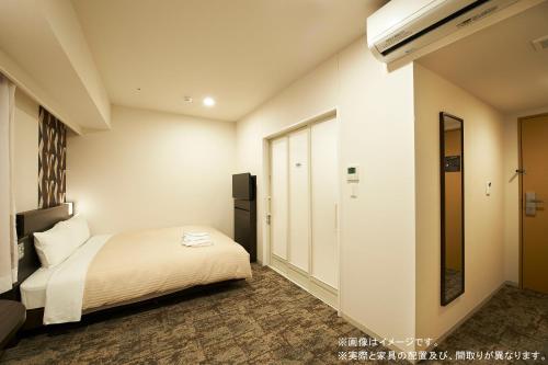 Imagen de la habitación del Hotel Sotetsu Fresa Inn Sendai. Foto 4
