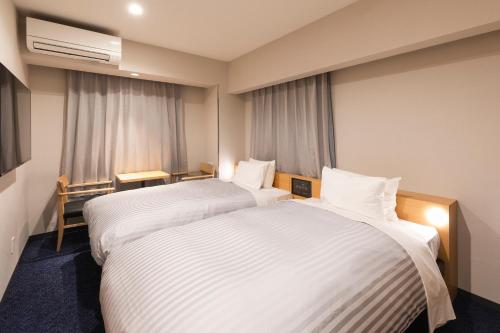 Imagen de la habitación del Hotel Sotetsu Fresa Inn Sendai. Foto 6