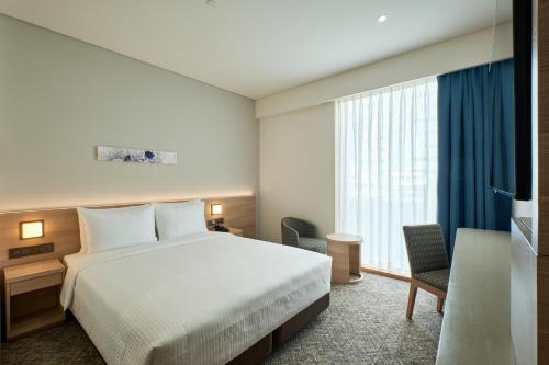 Imagen de la habitación del Hotel Sotetsu Grand Fr&eacute;sa Saigon. Foto 2