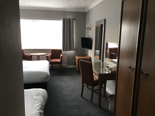 Imagen de la habitación del Hotel South Lawn. Foto 12
