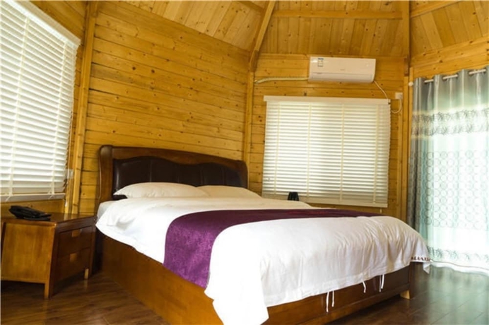 Imagen de la habitación del Hotel Southeastern Flying Tiger Manor. Foto 4