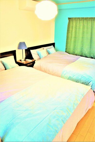 Imagen de la habitación del Hotel Spacious Apartment Sunshine City. Foto 25