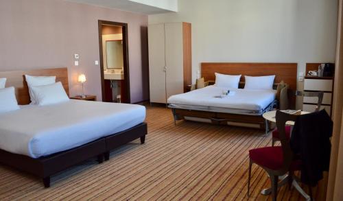 Imagen de la habitación del Hotel Spark by Hilton Lyon Ouest. Foto 8