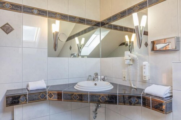 Imagen de la habitación del Hotel Sport - und Tagungshotel De Poort. Foto 9