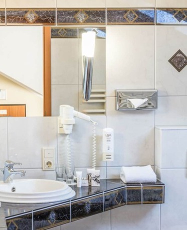 Imagen de la habitación del Hotel Sport - und Tagungshotel De Poort. Foto 12
