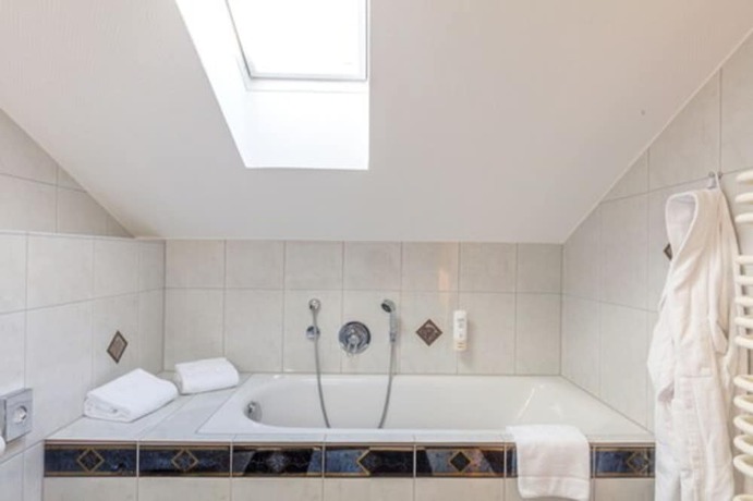 Imagen de la habitación del Hotel Sport - und Tagungshotel De Poort. Foto 13