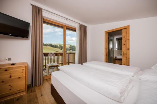 Imagen de la habitación del Hotel Sporthotel Floralpina. Foto 7