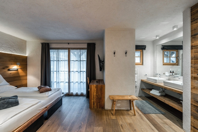 Imagen de la habitación del Hotel Sportony Mountain Lodges. Foto 3