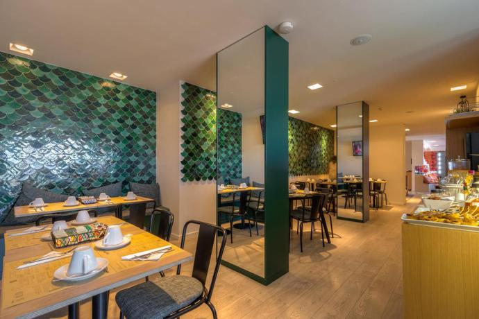 Imagen del bar/restaurante del Hotel Spot Family Suites. Foto 4