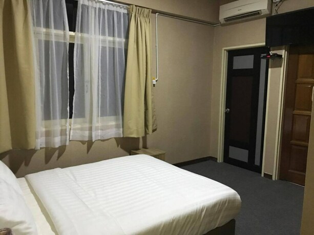 Imagen de la habitación del Hotel Spot On 89645 Ong's Court. Foto 21