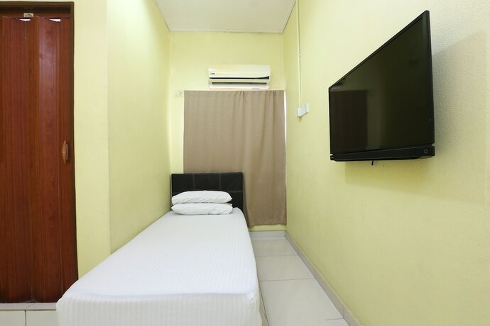 Imagen de la habitación del Hotel Spot On 89925 Thank Q Inn 1. Foto 12