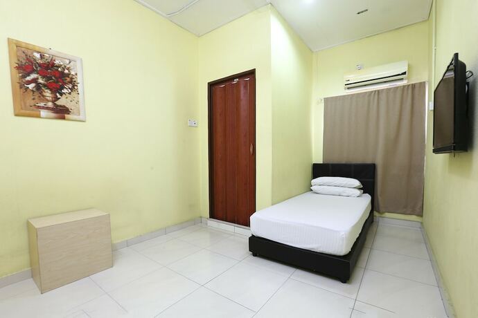 Imagen de la habitación del Hotel Spot On 89925 Thank Q Inn 1. Foto 16