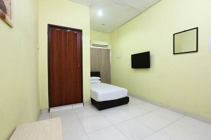 Imagen de la habitación del Hotel Spot On 89925 Thank Q Inn 1. Foto 24