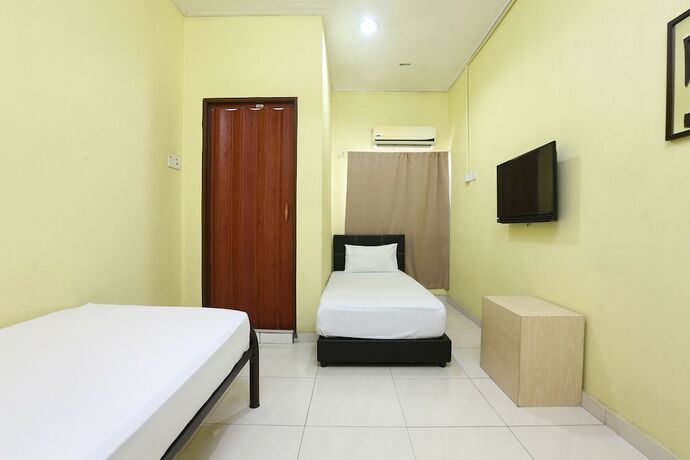 Imagen de la habitación del Hotel Spot On 89925 Thank Q Inn 1. Foto 29